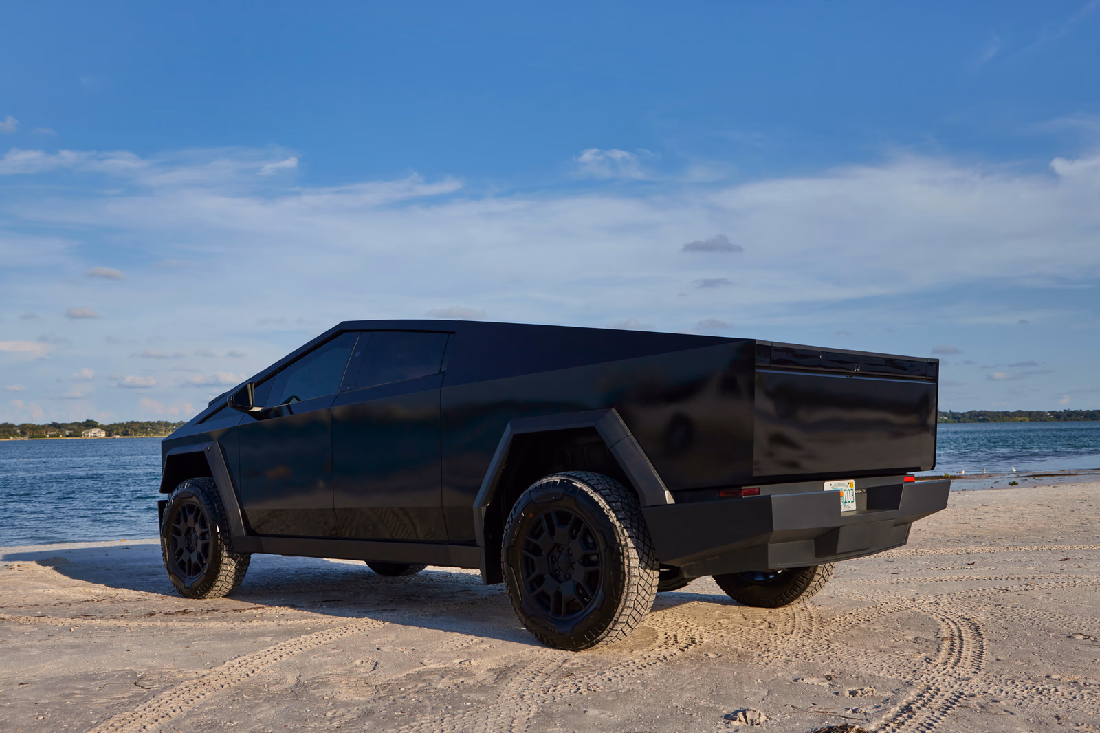 Gloss black full vehicle wrap on a Tesla Cybertruck installed by Wrapmate in Pensacola, FL